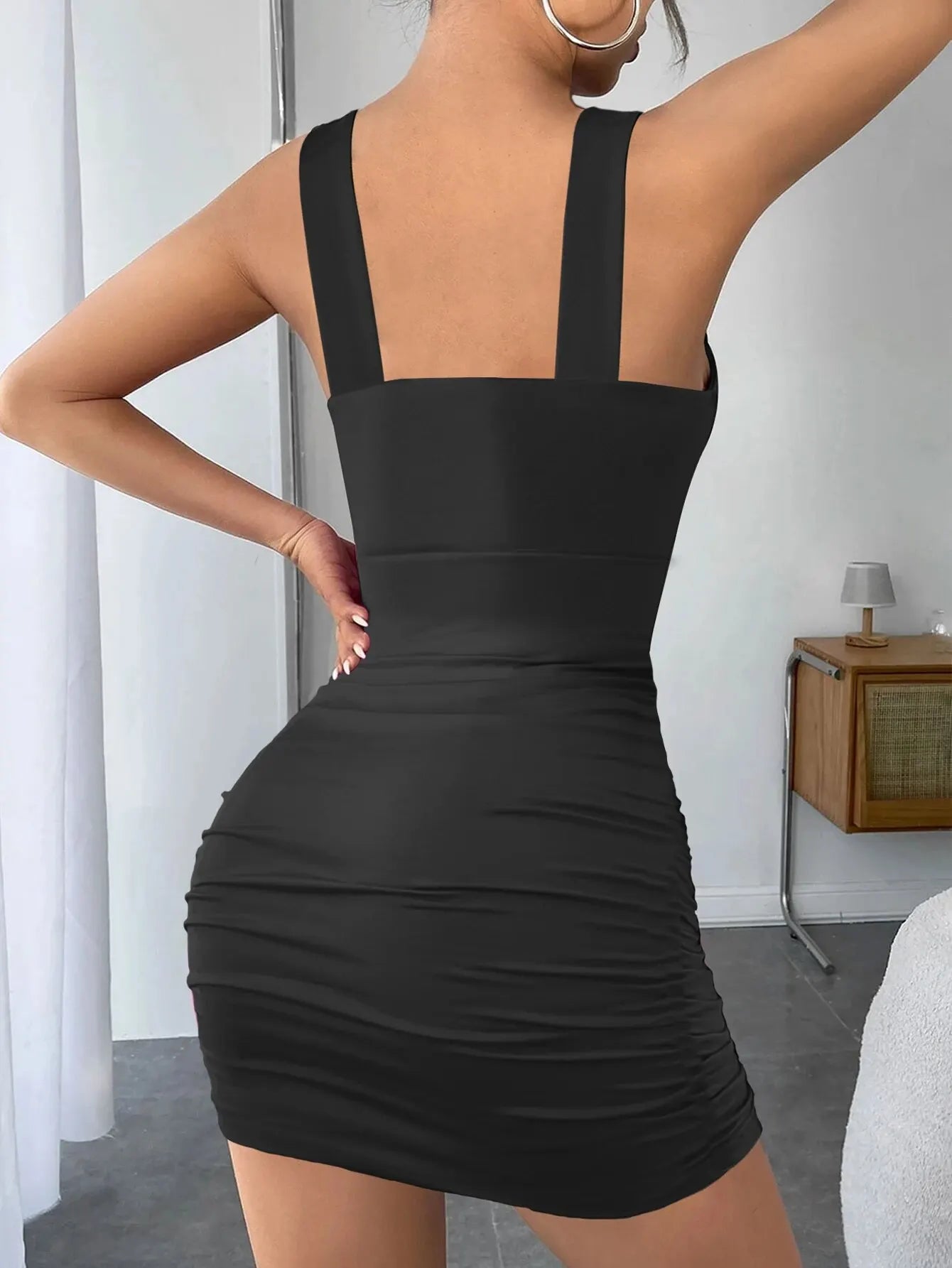 "Backless V-Neck Mini Dress: Sultry Spaghetti Straps for Club Parties 2024"