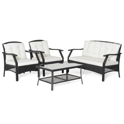 "Outdoor Oasis: 4-Piece Rattan Patio Set with Coffee Table and Cushions"