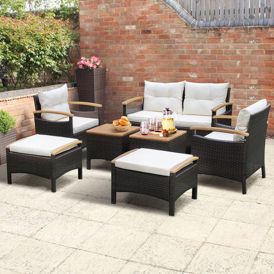 "7-Piece Outdoor Rattan Sofa Set with Cushions and Ottomans"